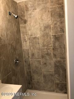 5122 Birkenhead Road Jacksonville, FL 32210 - Photo 25 of 31 a bathroom with a shower