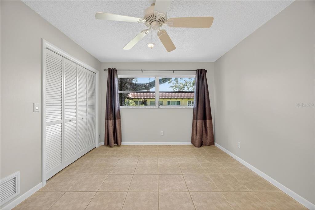 1701 Pinehurst Road, Unit 36C Dunedin, FL 34698 - Photo 11 of 25 an empty room with windows and closet
