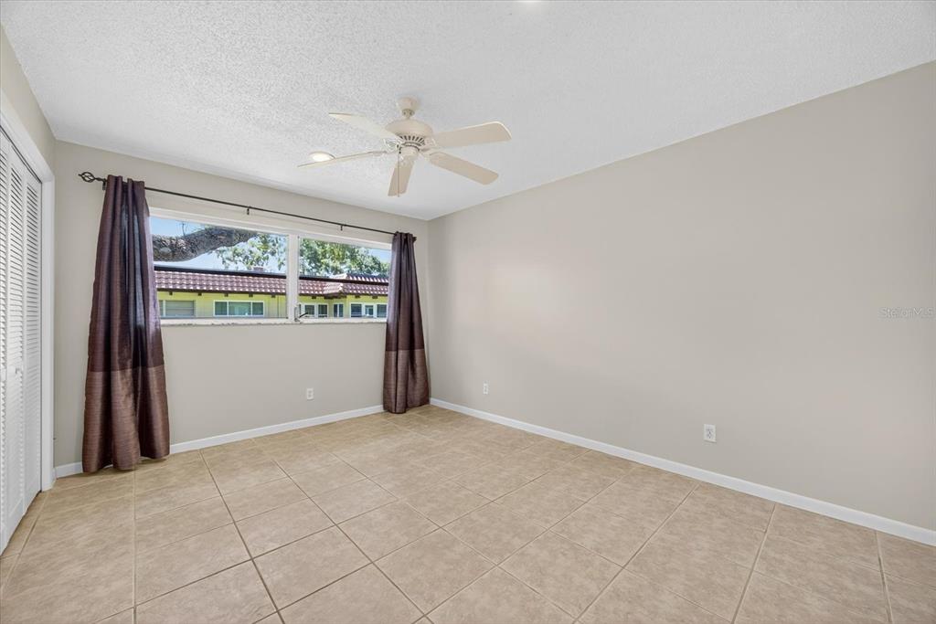 1701 Pinehurst Road, Unit 36C Dunedin, FL 34698 - Photo 12 of 25 a view of an empty room with a window