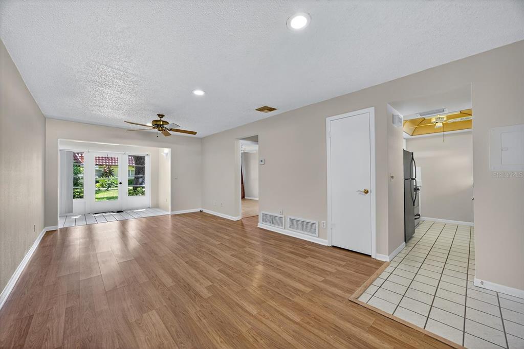 1701 Pinehurst Road, Unit 36C Dunedin, FL 34698 - Photo 14 of 25 a view of empty room with wooden floor and fan