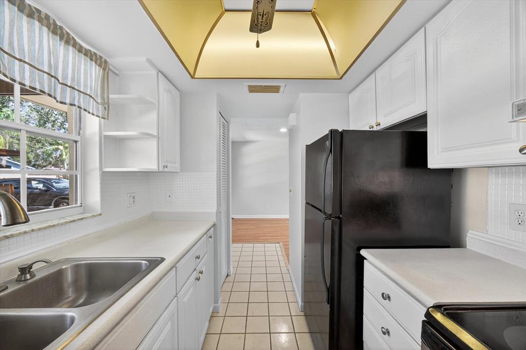 1701 Pinehurst Road, Unit 36C Dunedin, FL 34698 - Photo 15 of 25 a kitchen with a sink and a refrigerator