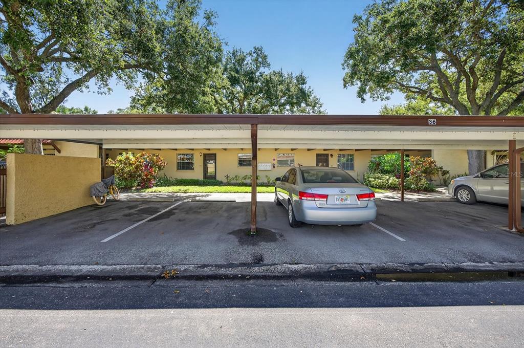 1701 Pinehurst Road, Unit 36C Dunedin, FL 34698 - Photo 17 of 25 a view of a cars park in front of a house
