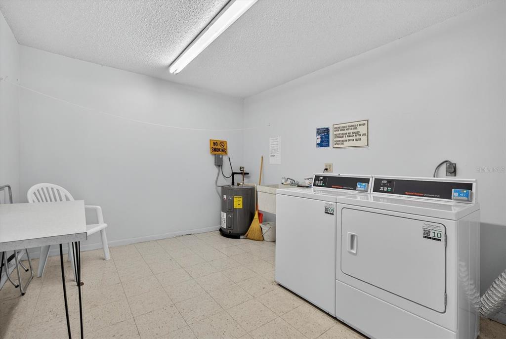 1701 Pinehurst Road, Unit 36C Dunedin, FL 34698 - Photo 19 of 25 a utility room with dryer and washer