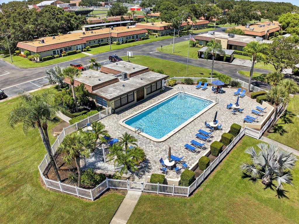 1701 Pinehurst Road, Unit 36C Dunedin, FL 34698 - Photo 21 of 25 an aerial view of a house with a garden and pool