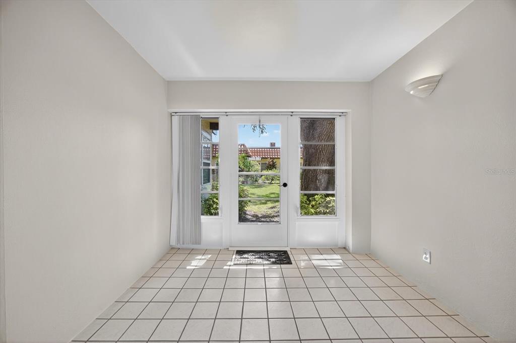 1701 Pinehurst Road, Unit 36C Dunedin, FL 34698 - Photo 8 of 25 a view of an entryway with wooden floor