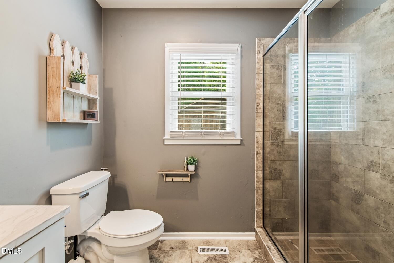 134 Longview Road Madison, NC 27025 - Photo 30 of 49 a bathroom with a toilet and a shower