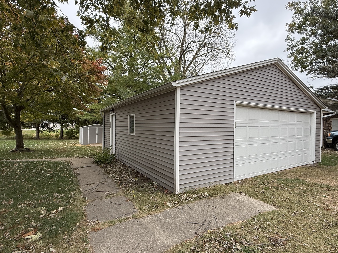 1 East Main Street Amboy, IL 61310 - Photo 13 of 32 a view of a house with a yard and garage