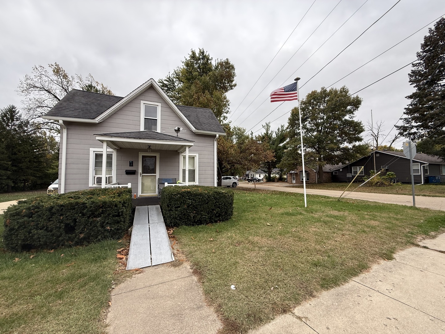 1 East Main Street Amboy, IL 61310 - Photo 2 of 32 a front view of a house with garden