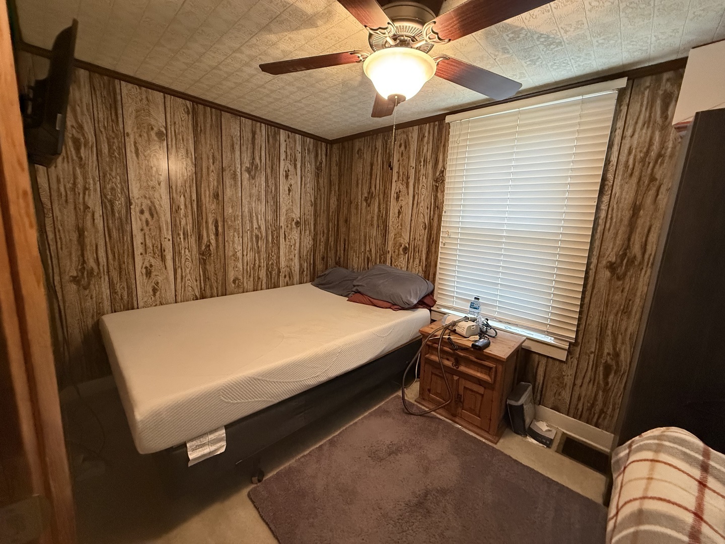 1 East Main Street Amboy, IL 61310 - Photo 24 of 32 a bed sitting in a room next to a window