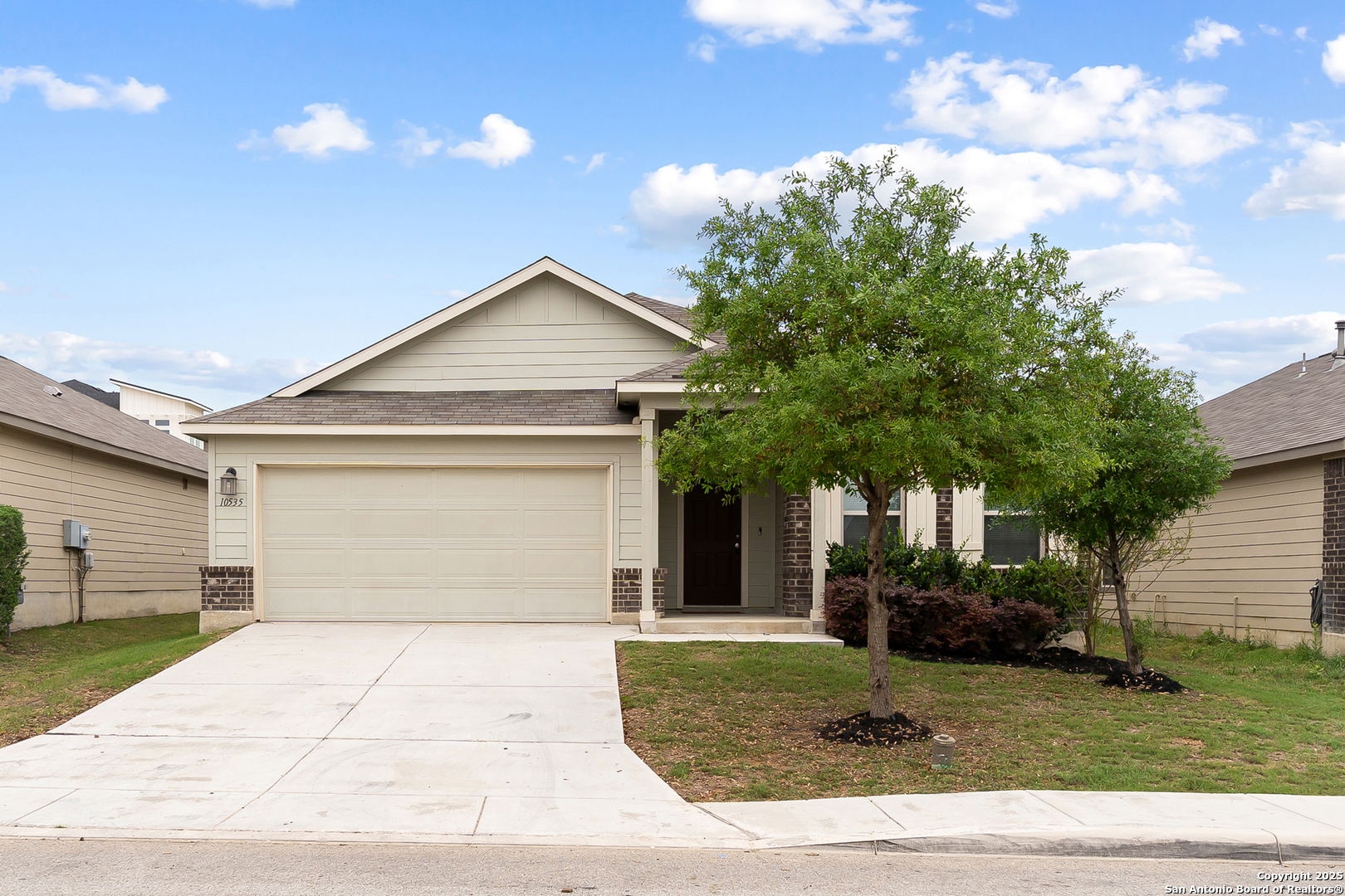 a front view of a house with garden