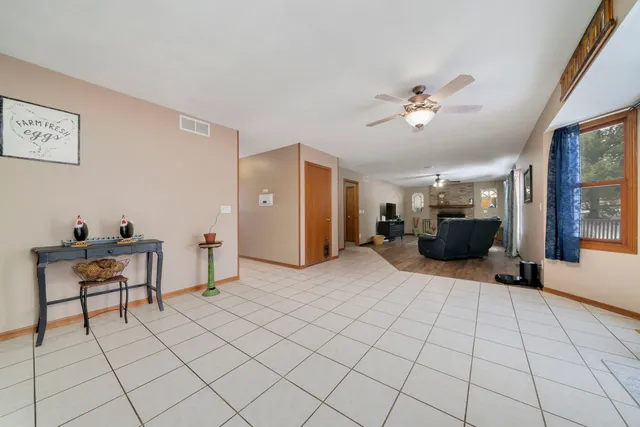 a view of a livingroom with furniture and a window