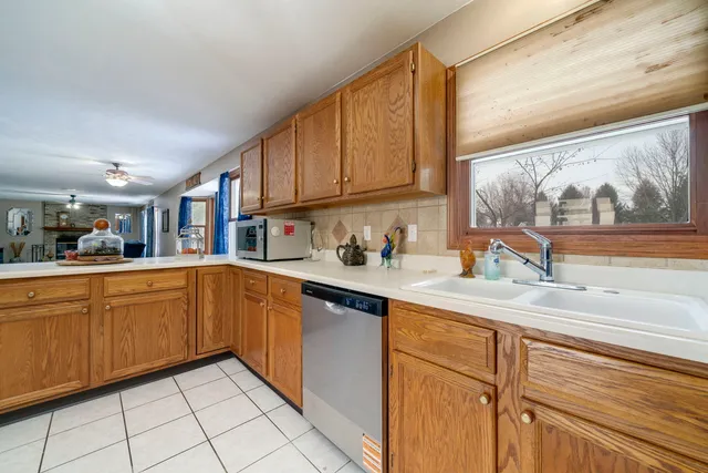 a kitchen with stainless steel appliances granite countertop a sink and cabinets