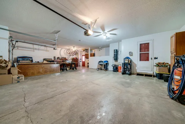 a view of a garage with cars