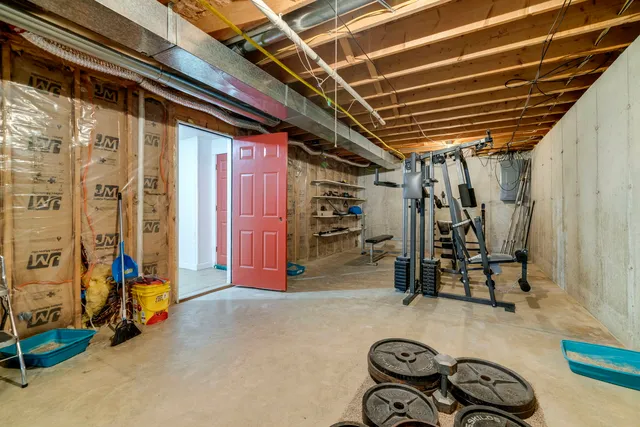 a view of a hallway with wooden walls and stairs