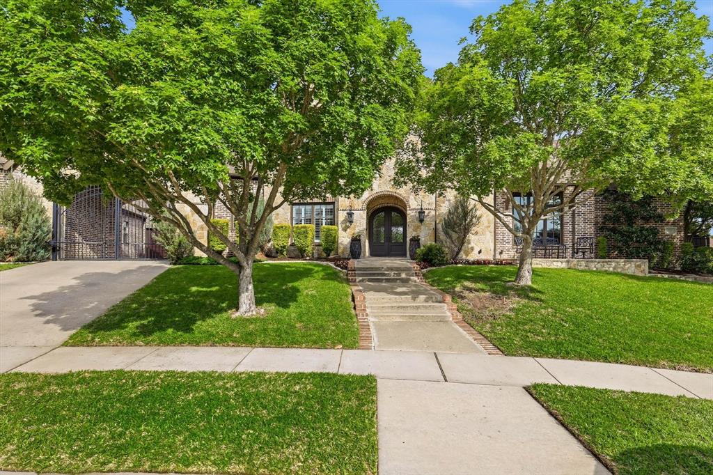476 Hidden Valley Lane Coppell, TX 75019 - Photo 1 of 40 a view of backyard with large trees