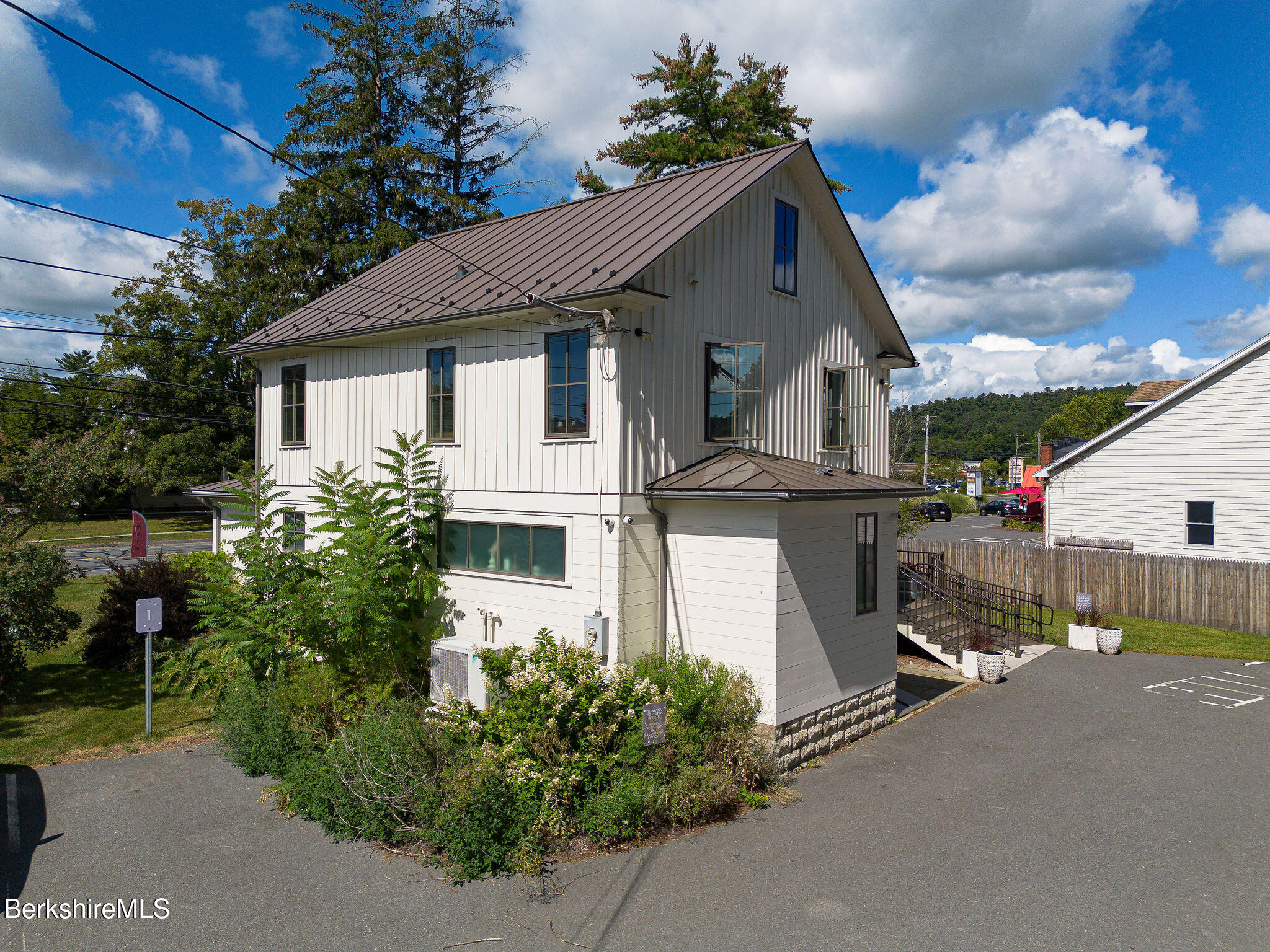 783 Main Street Great Barrington, MA 01230 - Photo 28 of 31 a view of a house with a small yard and sitting area