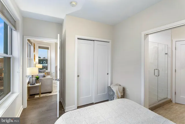 a bedroom with a bed and a bathroom