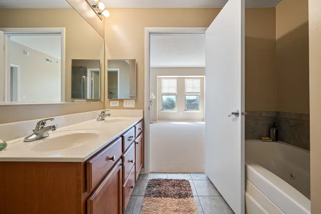 a kitchen with a stove top oven sink and cabinets
