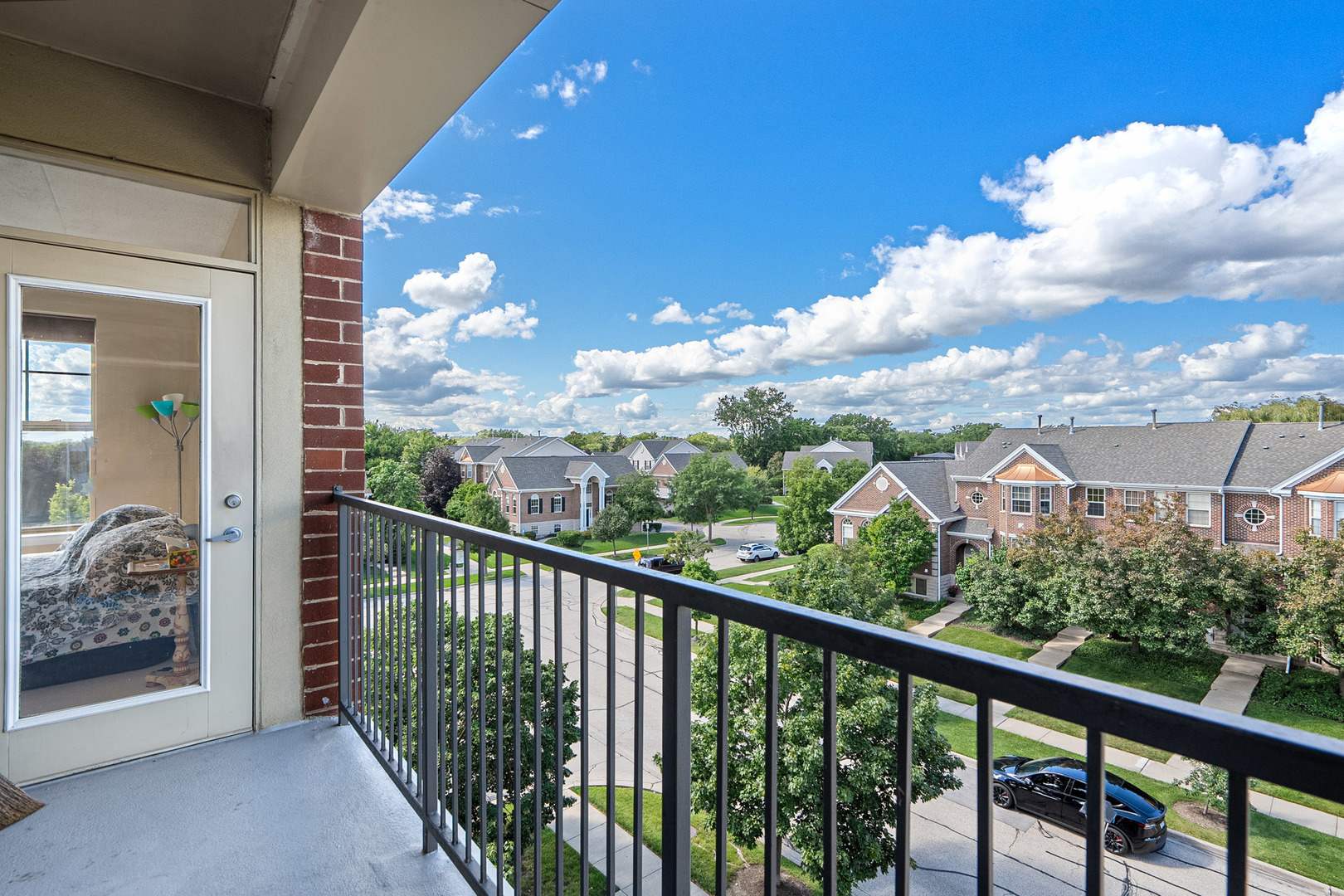 511 Prestwick Lane, Unit 402 Wheeling, IL 60090 - Photo 4 of 27 a view of a city from a balcony