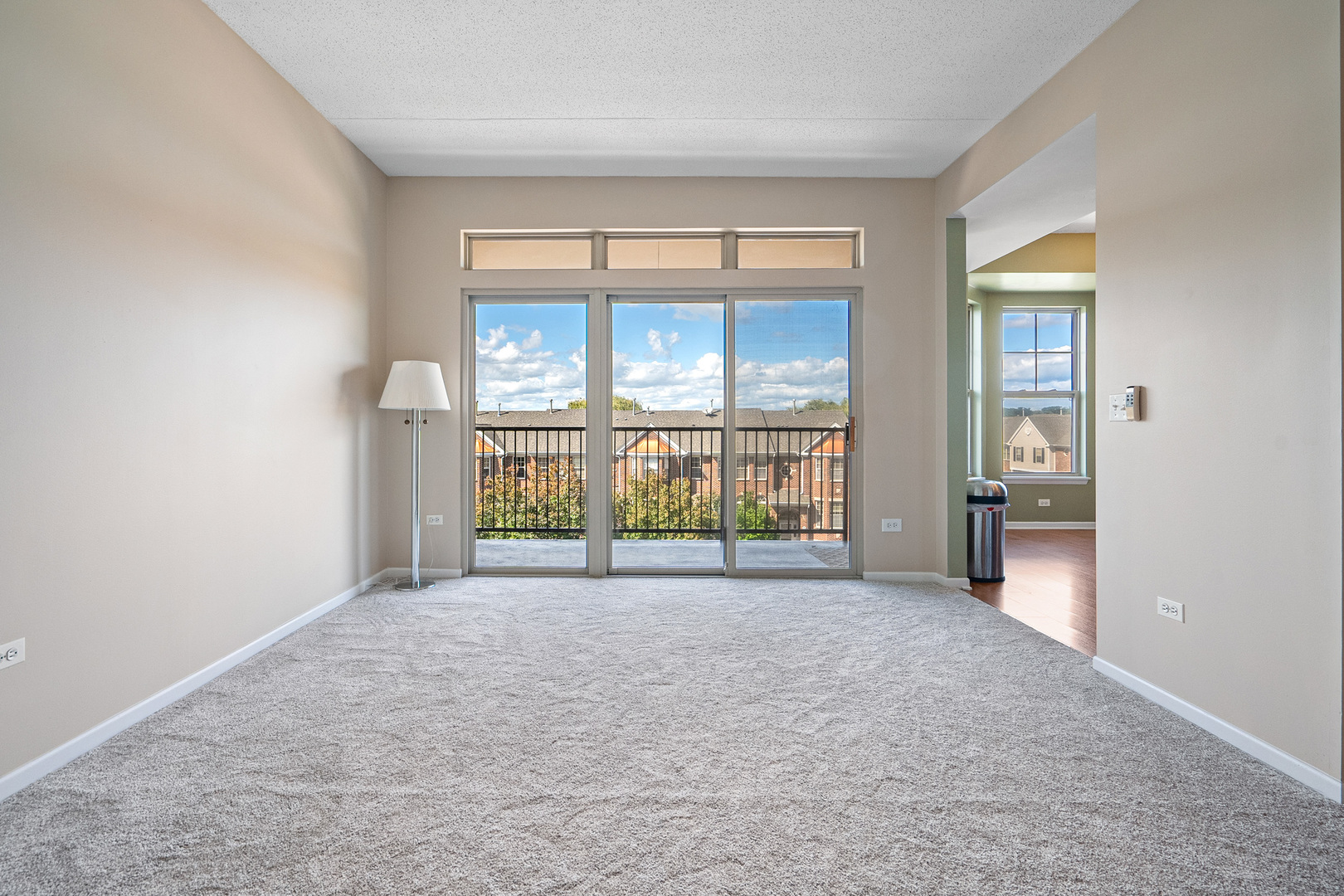 511 Prestwick Lane, Unit 402 Wheeling, IL 60090 - Photo 8 of 27 an empty room with windows