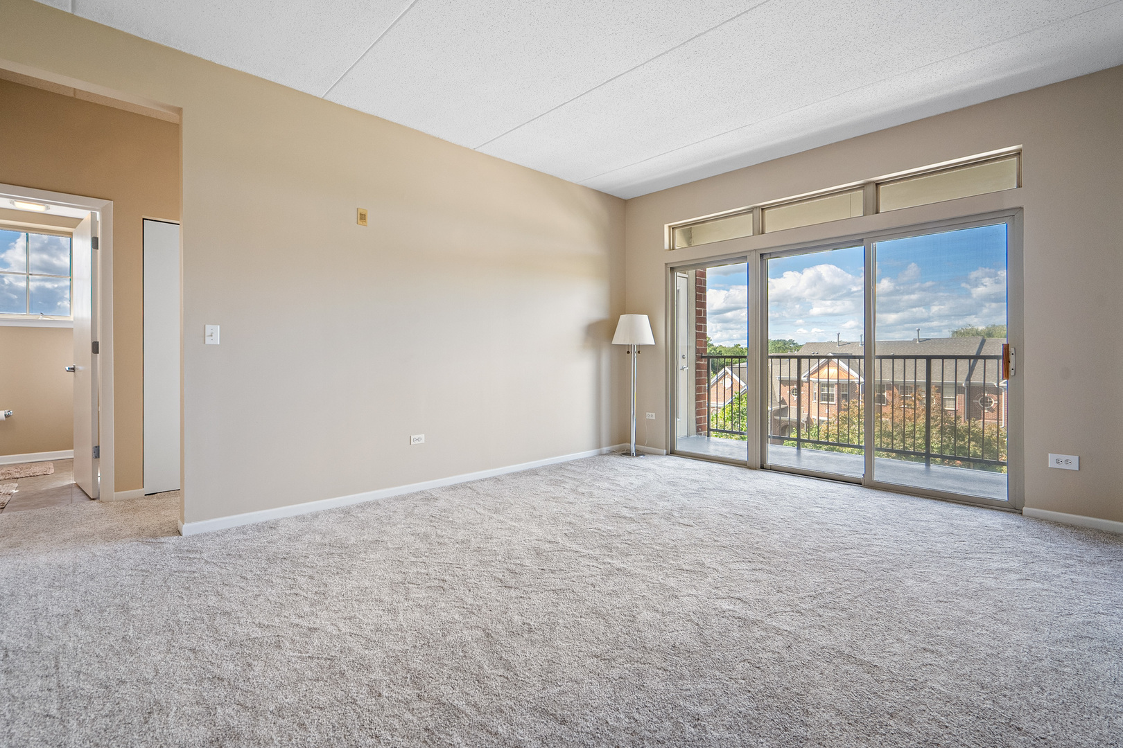511 Prestwick Lane, Unit 402 Wheeling, IL 60090 - Photo 9 of 27 a view of an empty room with a window