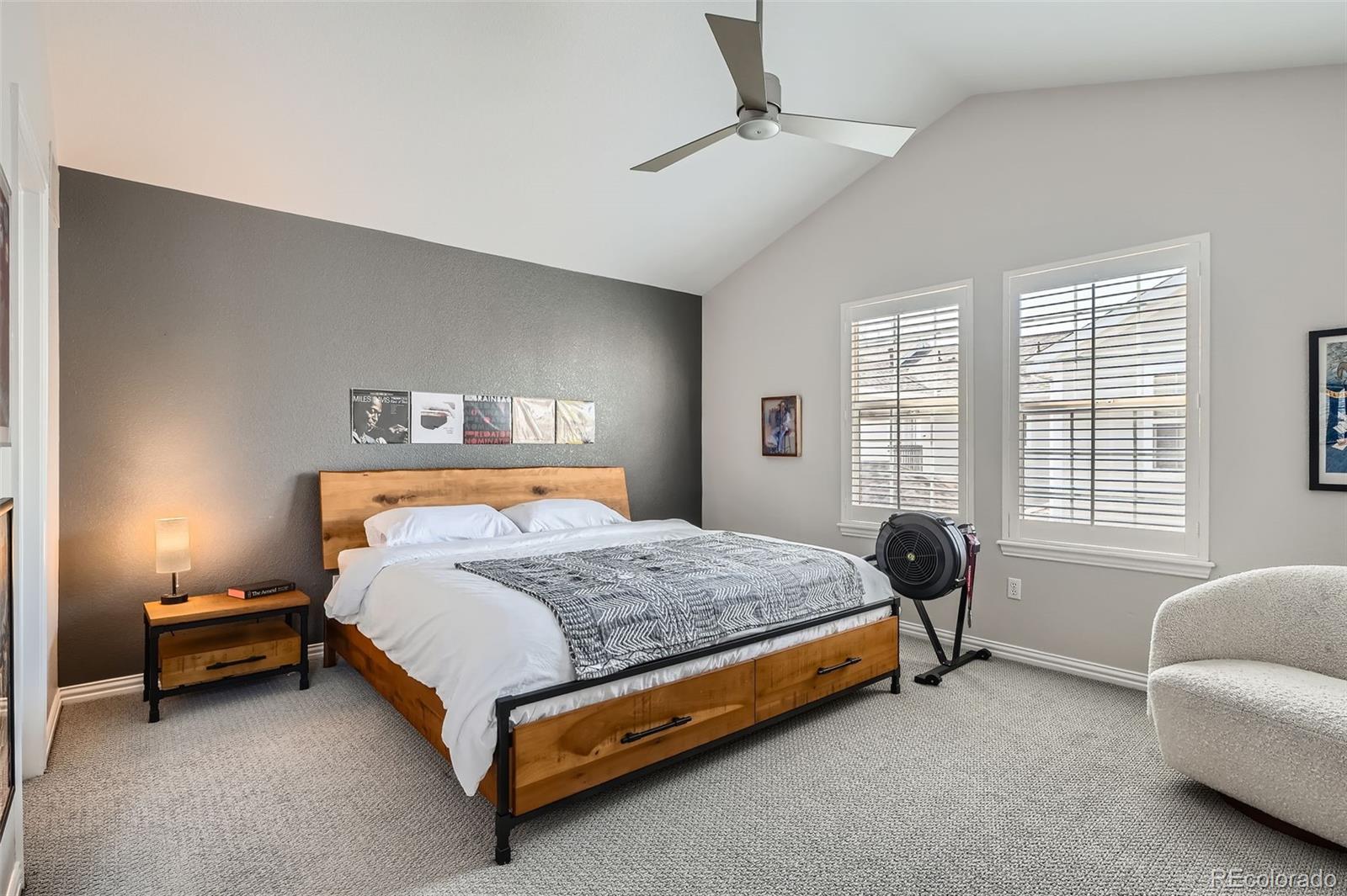 8300 Fairmount Drive, Unit AA102 Denver, CO 80247 - Photo 13 of 27 a bedroom with a bed and a couch