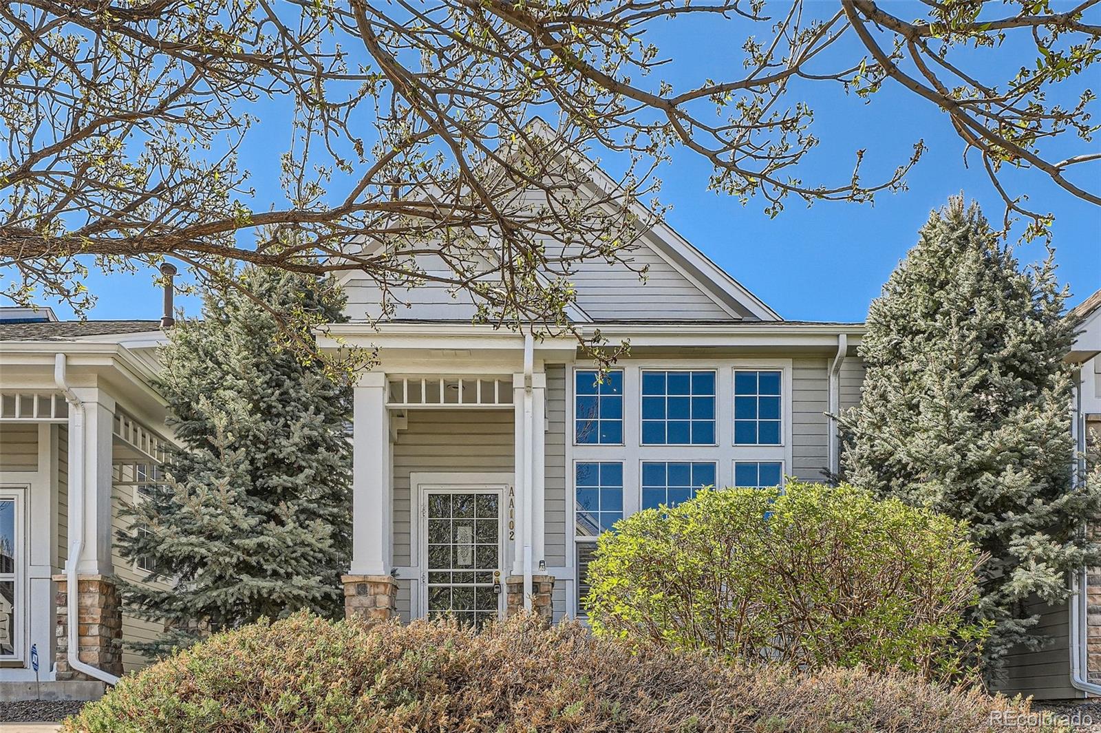 8300 Fairmount Drive, Unit AA102 Denver, CO 80247 - Photo 2 of 27 front view of a house