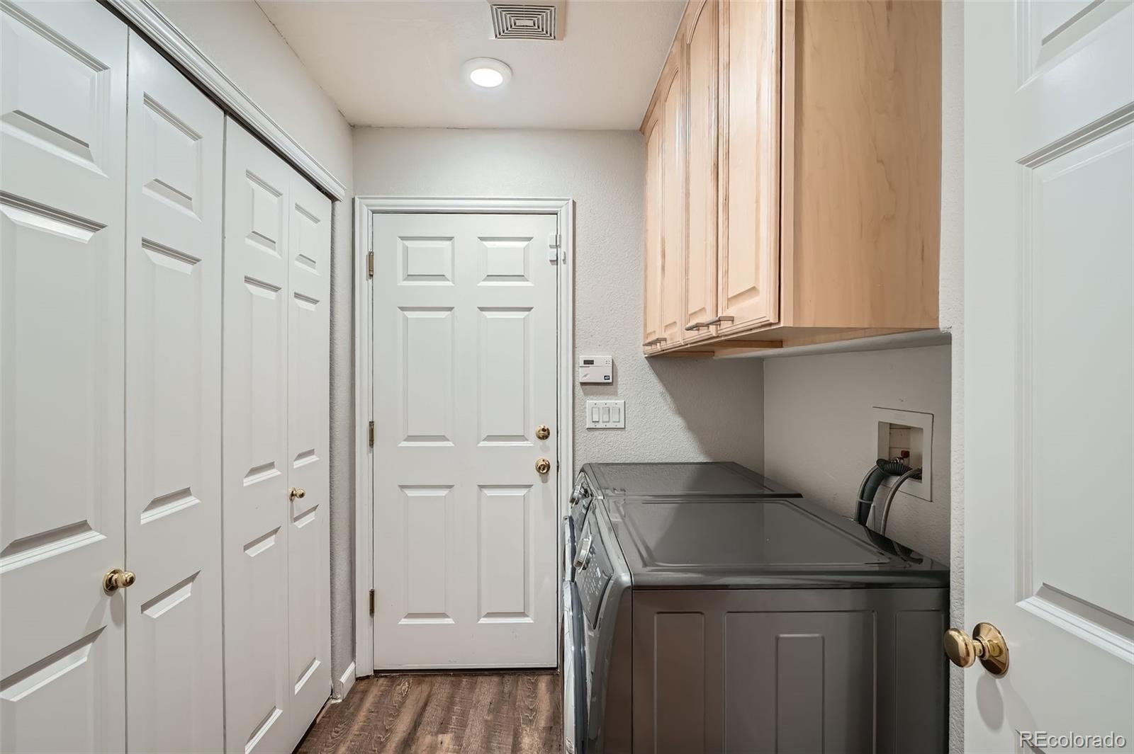8300 Fairmount Drive, Unit AA102 Denver, CO 80247 - Photo 21 of 27 a storage room with cabinets