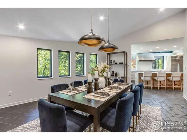 a view of a dining room with furniture window and outside view