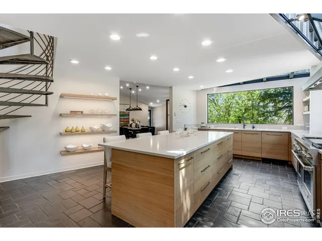 a kitchen with a stove a sink and a refrigerator