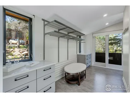a bathroom with a granite countertop sink toilet a mirror and bathtub