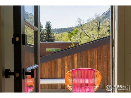 a view of balcony with wooden floor