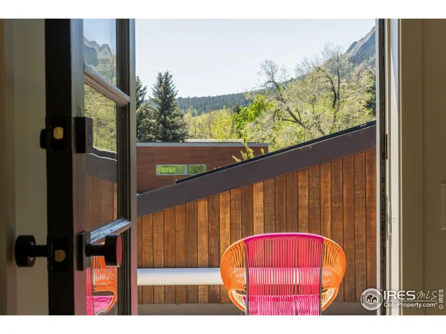 a view of balcony with wooden floor