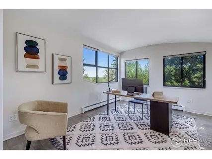 a living room with furniture a window and a table