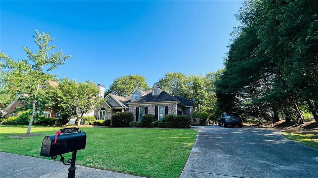 8569 Spring Breeze Terrace Suwanee, GA 30024 - Photo 2 of 39
