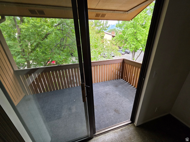 6852 Countrywoods Circle, Unit 5D Midvale, UT 84047 - Photo 9 of 50 Private balcony featuring durable outdoor carpeting and vertical slat railing