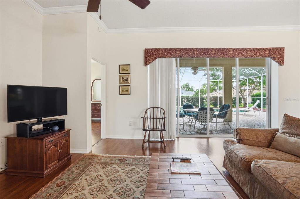14228 Presteign Lane Spring Hill, FL 34609 - Photo 20 of 89 a living room with furniture and a flat screen tv