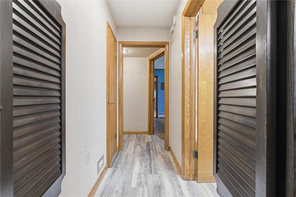 312 Flatwoods Road Vanderbilt, PA 15486 - Photo 18 of 48 a view of a hallway with wooden floor