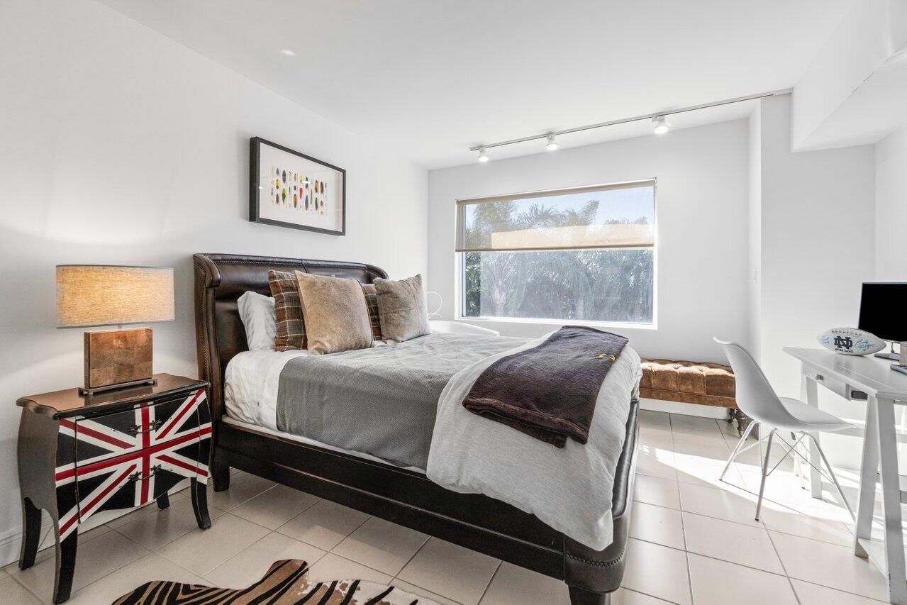 44 Cocoanut Row, Unit 120B Palm Beach, FL 33480 - Photo 13 of 51 a bedroom with a bed and a window