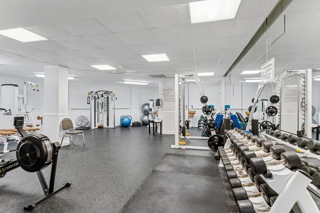 a view of a swimming pool with a yard