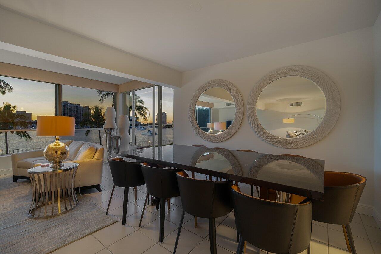 44 Cocoanut Row, Unit 120B Palm Beach, FL 33480 - Photo 45 of 51 a view of a dining room with furniture and chandelier