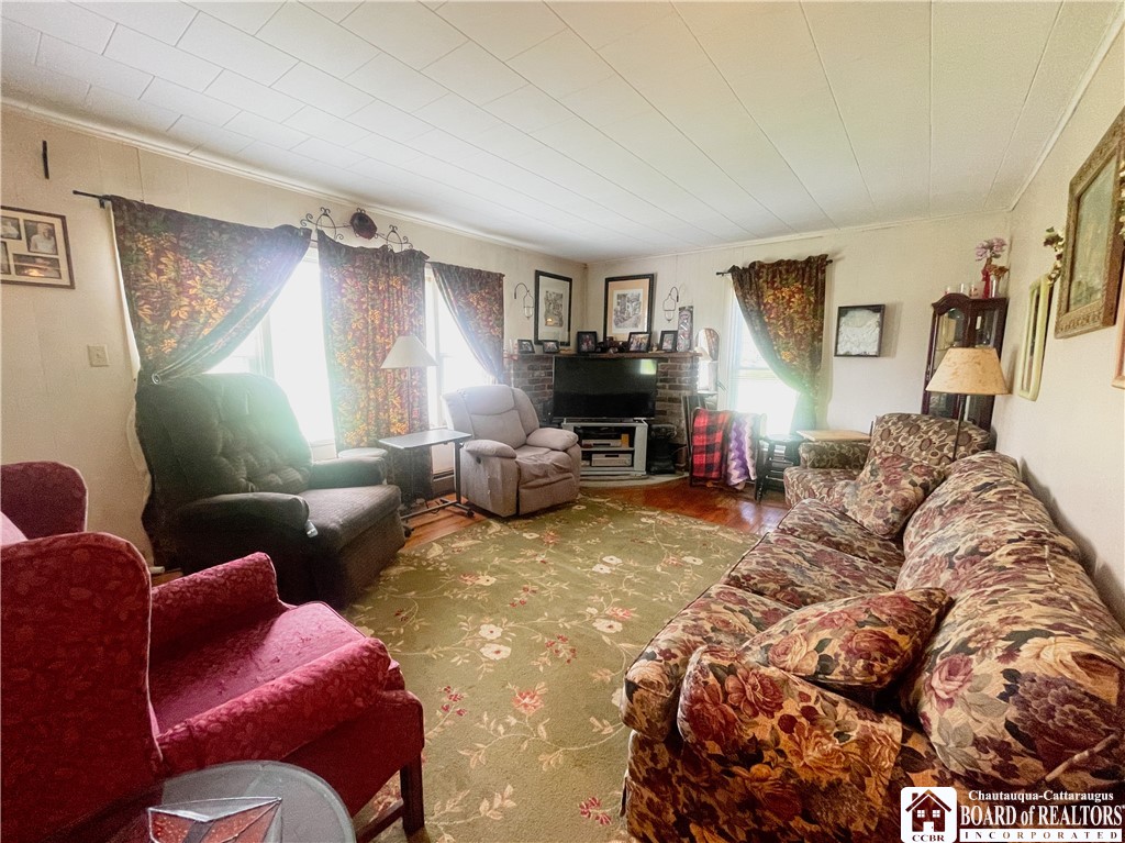 5200 Thornton Road Ellington, NY 14740 - Photo 10 of 20 LARGE LIVING ROOM WITH BRICK DETAILS BEHIND TV