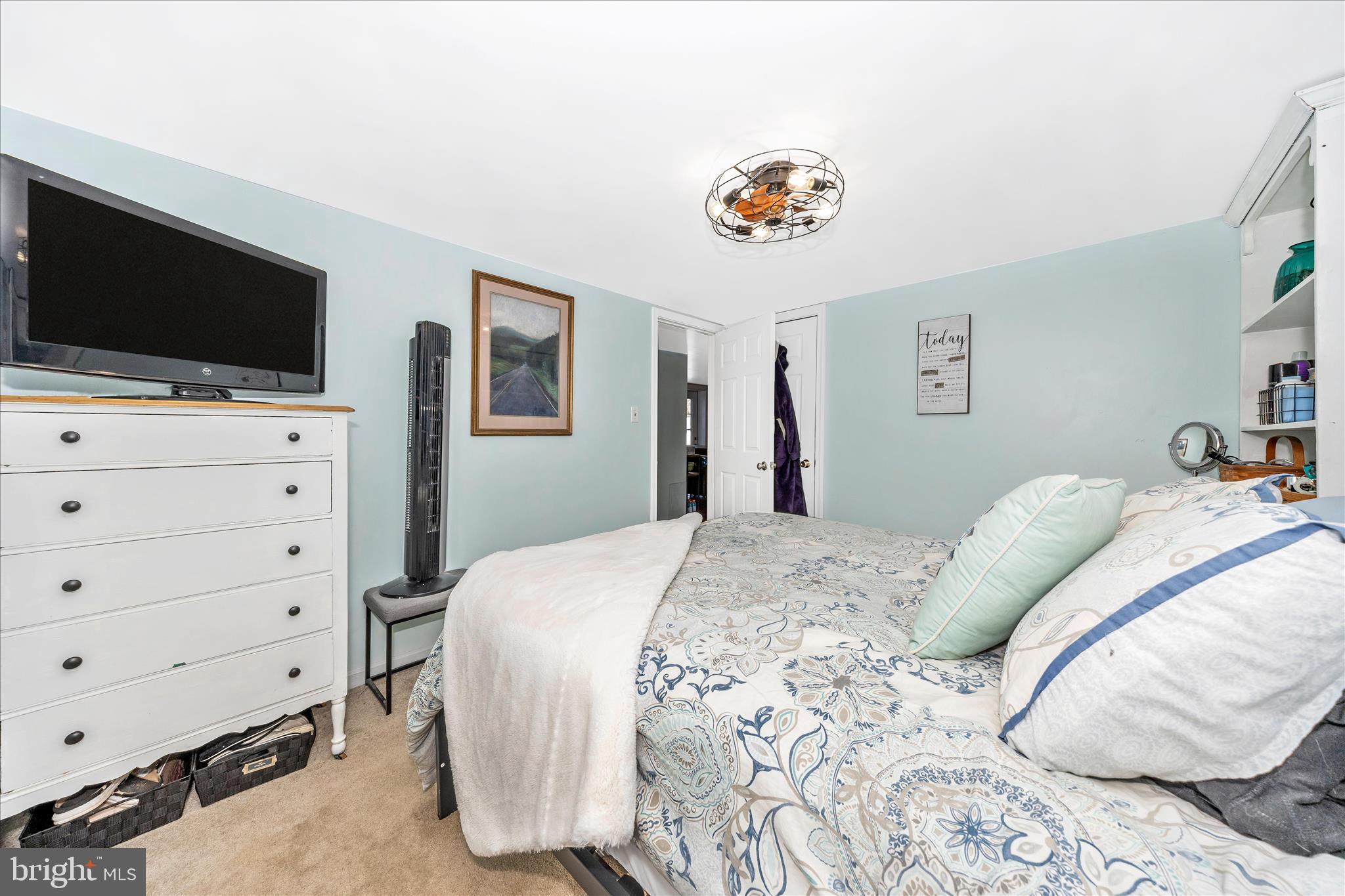 5618 Bartonsville Road Frederick, MD 21704 - Photo 17 of 53 a bedroom with a bed and flat screen tv