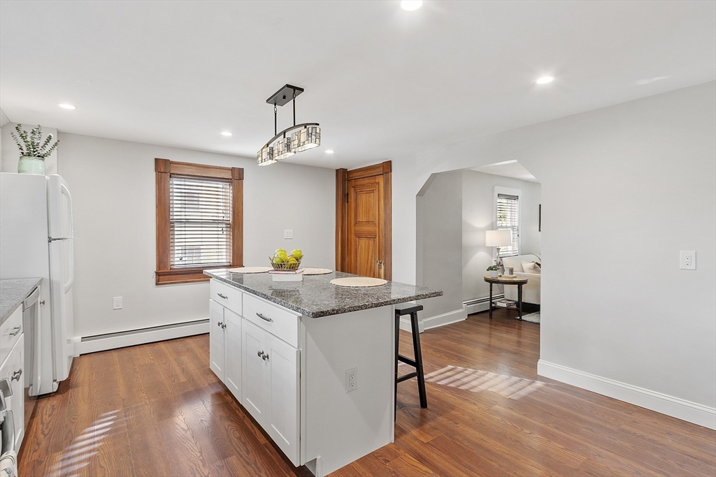 42 Stevens Street, Unit 42 Andover, MA 01810 - Photo 11 of 19 a kitchen with a sink and wooden floor