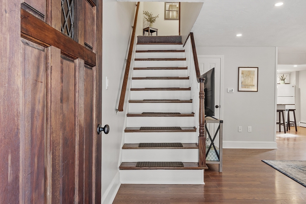 42 Stevens Street, Unit 42 Andover, MA 01810 - Photo 3 of 19 a view of entryway with wooden floor and stairs