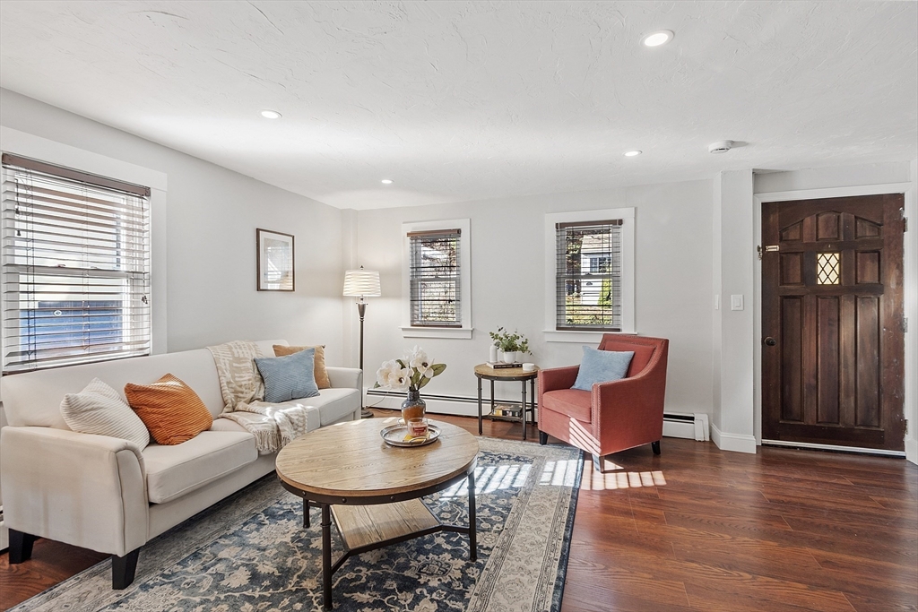 42 Stevens Street, Unit 42 Andover, MA 01810 - Photo 4 of 19 a living room with furniture a wooden floor and a window