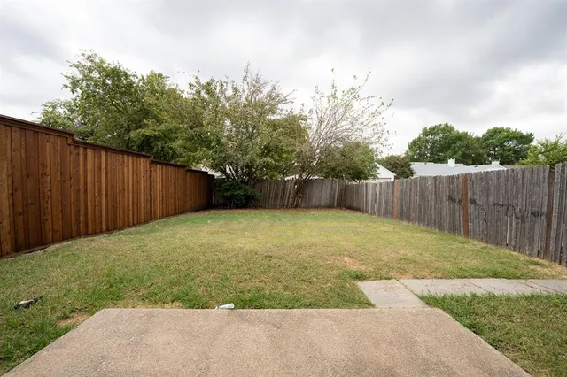 a view of a backyard with green space