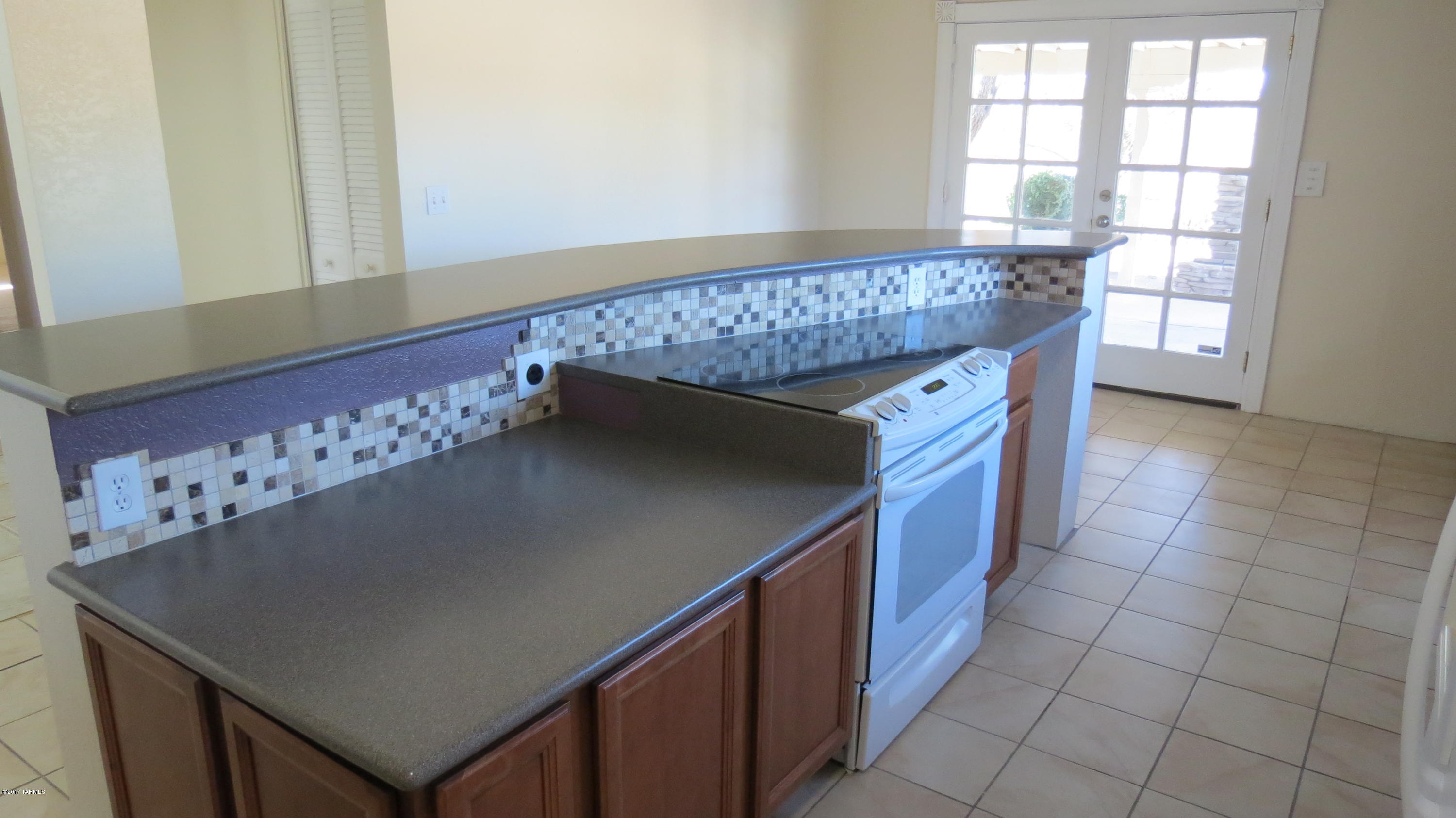 6601 North Mona Lisa Road Tucson, AZ 85741 - Photo 4 of 23 a kitchen with a sink a cabinets and window