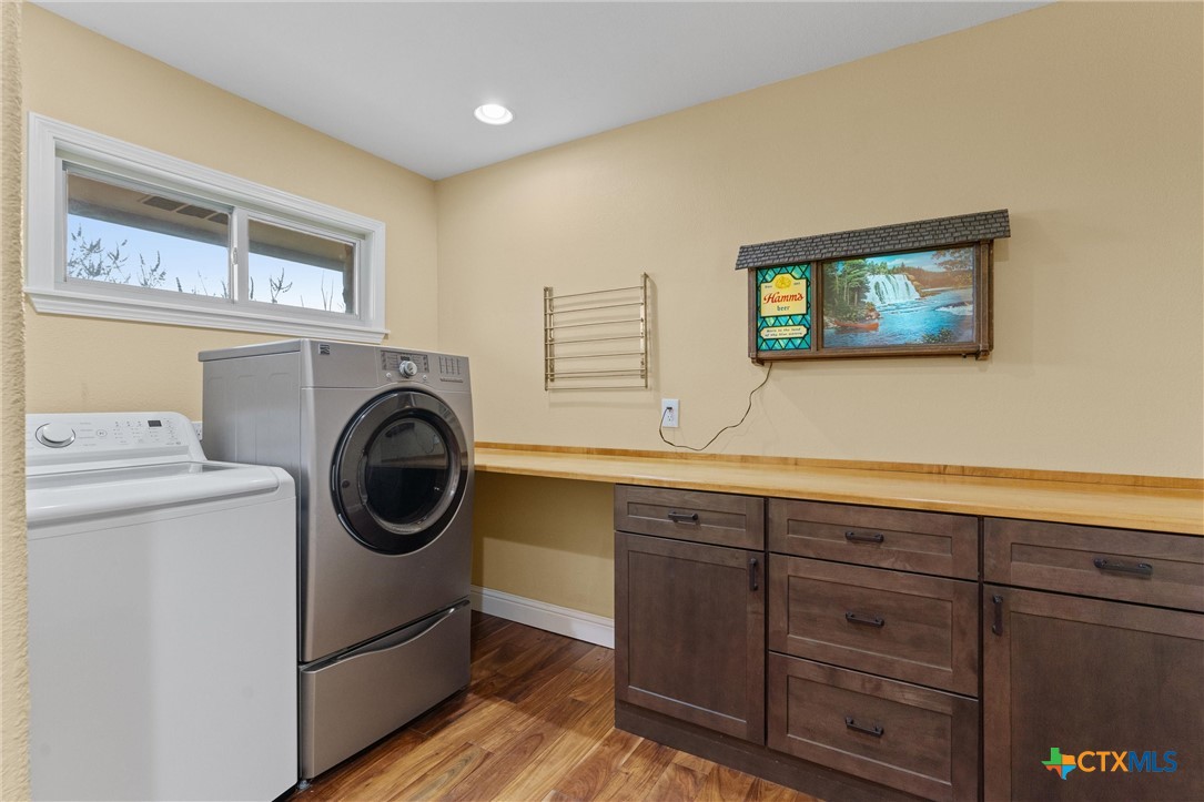 404 Skyline Road Georgetown, TX 78628 - Photo 15 of 40 a view of a storage & utility room with washer and dryer