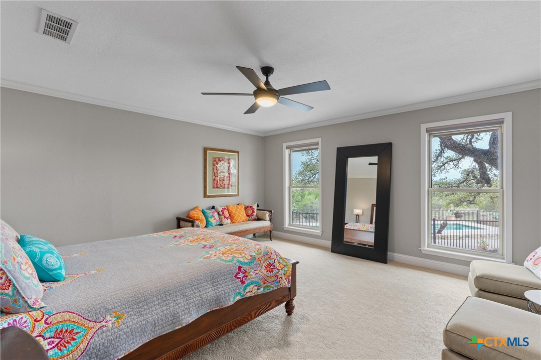 404 Skyline Road Georgetown, TX 78628 - Photo 17 of 40 a bedroom with a bed and furniture
